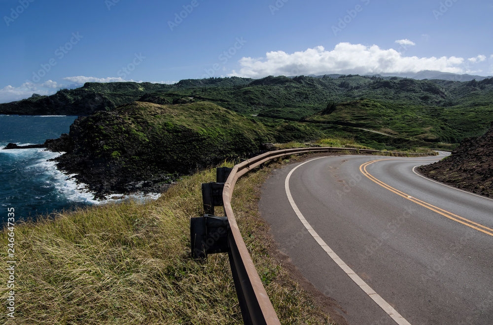 Maui Scenic Highway:  The Honoapiilani Highway passes beside a rocky coastline and curves into the mountains at the northwest end of Maui.