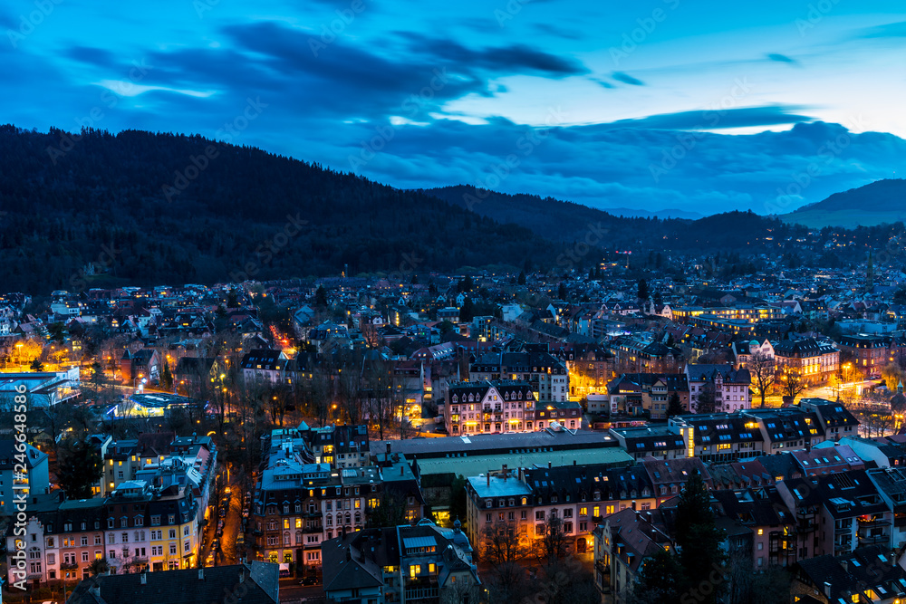 Germany, Houses and streets of city freiburg im breisgau in pretty blue hour light