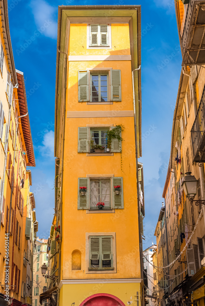Nice, narrow street in the Vieux Nice, ancient buildings, typical facades in the old town, French Riviera