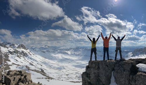 success and pride of climbers at the top of high mountains