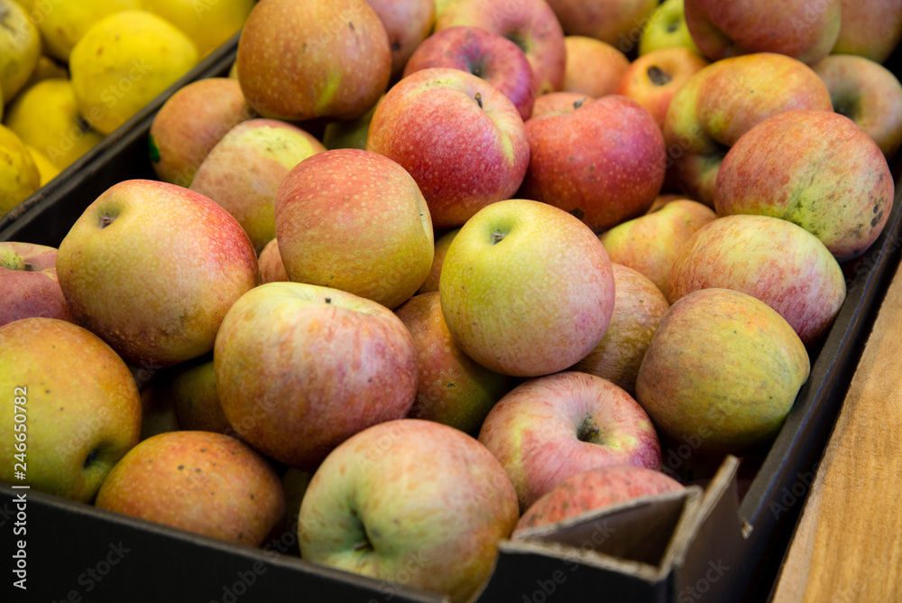 ripe red apples on the counter in the supermarket ripe red apples on the counter in the supermarket