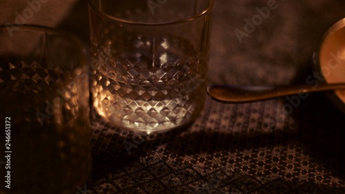 A glass of water near a plate during dinner