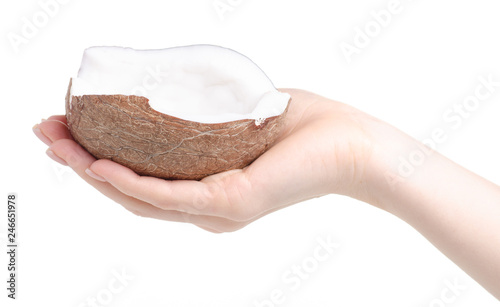 A piece of coconut in hand on a white background. Isolation