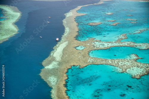 Queensland coral reef as seen from the airplane, aerial view on a sunny day