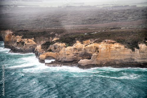 Aerial view of natural arch along Great Ocean Road on a stormy day, Australia