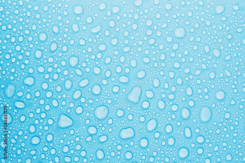 closeup drops water on blue background