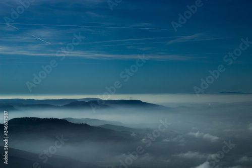 The "Schwäbische Alb" / ("Swabian Jura"), a mountain range in south western Germany. It´s a foggy day in the valley. Picture shot out of an airplane. 