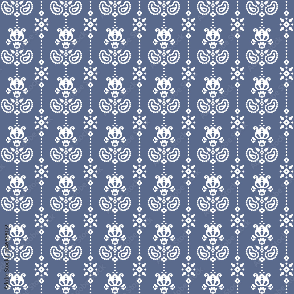 Seamless floral pattern in vector. Small white flowers and paisley on a blue background. Seamless floral pattern in vector. Small white flowers and paisley on a blue background.
