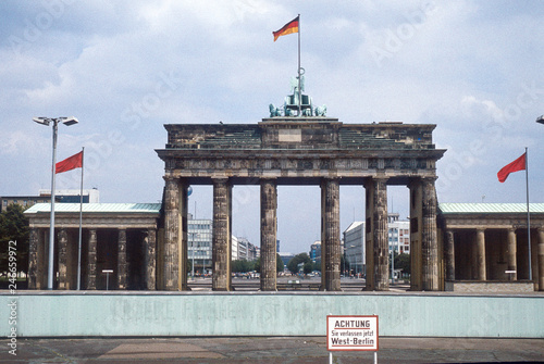 Historic image from July 1980: A look from West Berlin over the Berlin wall to Brandenburg Gate and East Berlin. Sign with 