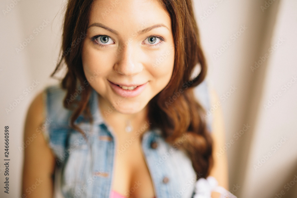 Beautiful brunette girl posing for portrait shoot in home studio Beautiful brunette girl posing for portrait shoot in home studio