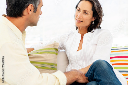 Couple talking together at home 