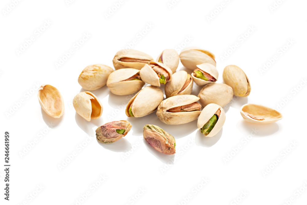 Pistachios isolated on a white background. Pistacia vera Pistachios isolated on a white background. Pistacia vera