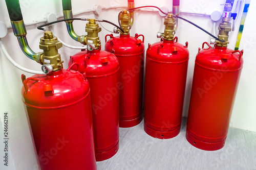 red fire extinguishing cylinders in industry. toning. 