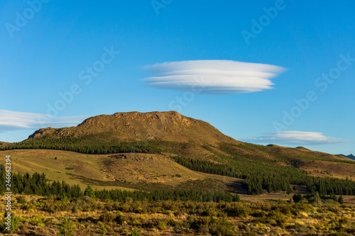 Andes mountain range against lenticular clouds in the sky