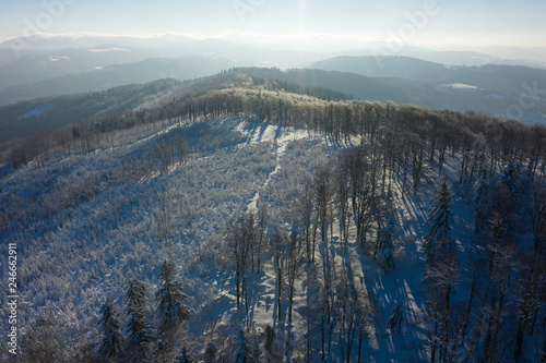 Winter scenery in Silesian Beskids mountains. View from Rownica, Ustron. View from above. Landscape photo captured with drone. Poland, Europe. photo