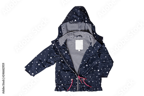Kids jacket isolated. A stylish fashionable dark blue jacket with white dots and blue white striped lining for the little girl. A rain coat and windbreaker with hood for spring and autumn. photo