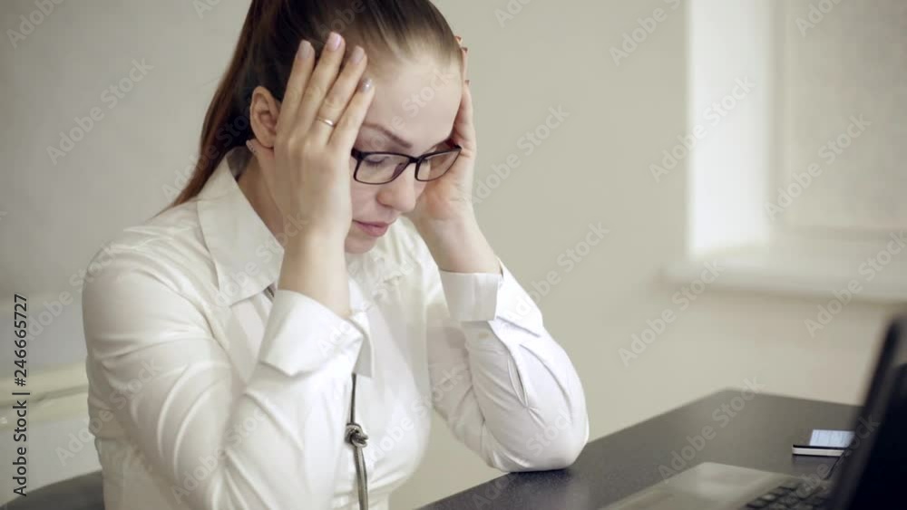 severe headaches in a woman in the office severe headaches in a woman in the office