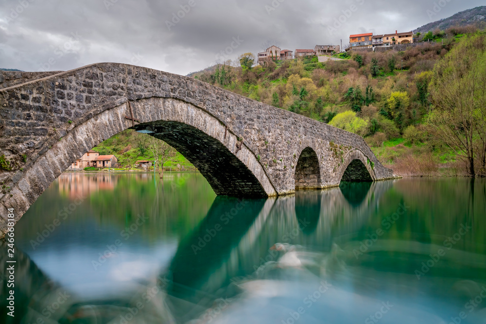 Ancient stone arch bridge in Rijeka Crnojevica Ancient stone arch bridge in Rijeka Crnojevica