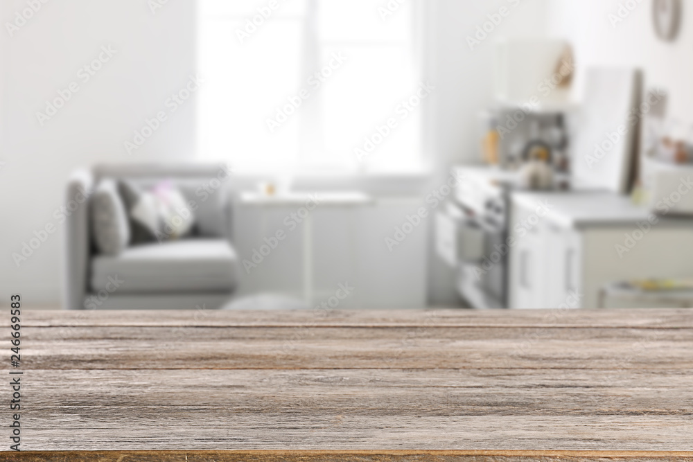 Empty brown wooden table in modern kitchen. Mockup for design