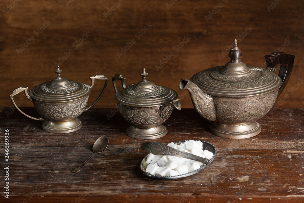 Old Tea service set with sugar on wooden background