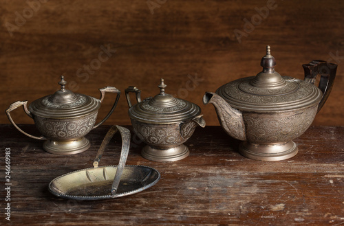 Old Tea service set with sugar on wooden background
