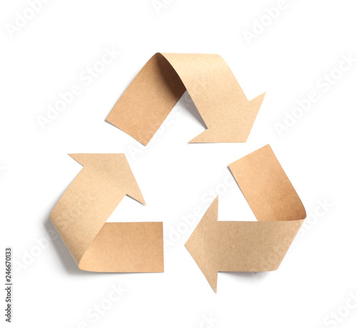 Recycling symbol cut out of kraft paper on white background, top view