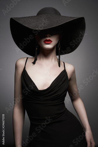 portrait of young lady with black hat and evening dress