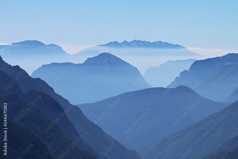 Alpine peaks, Doss del Sabion, Pinzolo, Trentino NorthernItaly. Breathtaking landscapes above 2100 Meters. Center of the Adamello Brenta natural park with beautiful thin mist layers over dolomite peak