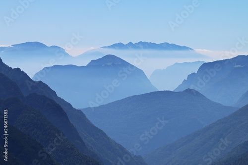 Alpine peaks, Doss del Sabion, Pinzolo, Trentino NorthernItaly. Breathtaking landscapes above 2100 Meters. Center of the Adamello Brenta natural park with beautiful thin mist layers over dolomite peak © Fotorina