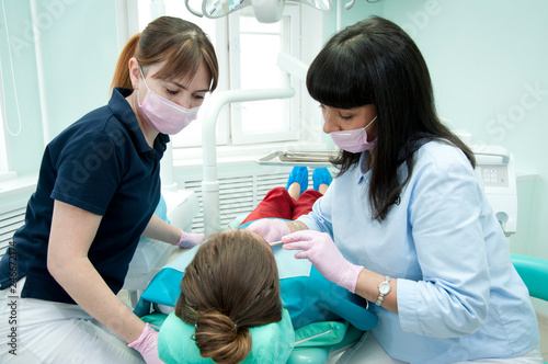 Doctors of the dental surgical department perform a dental surgical operation.