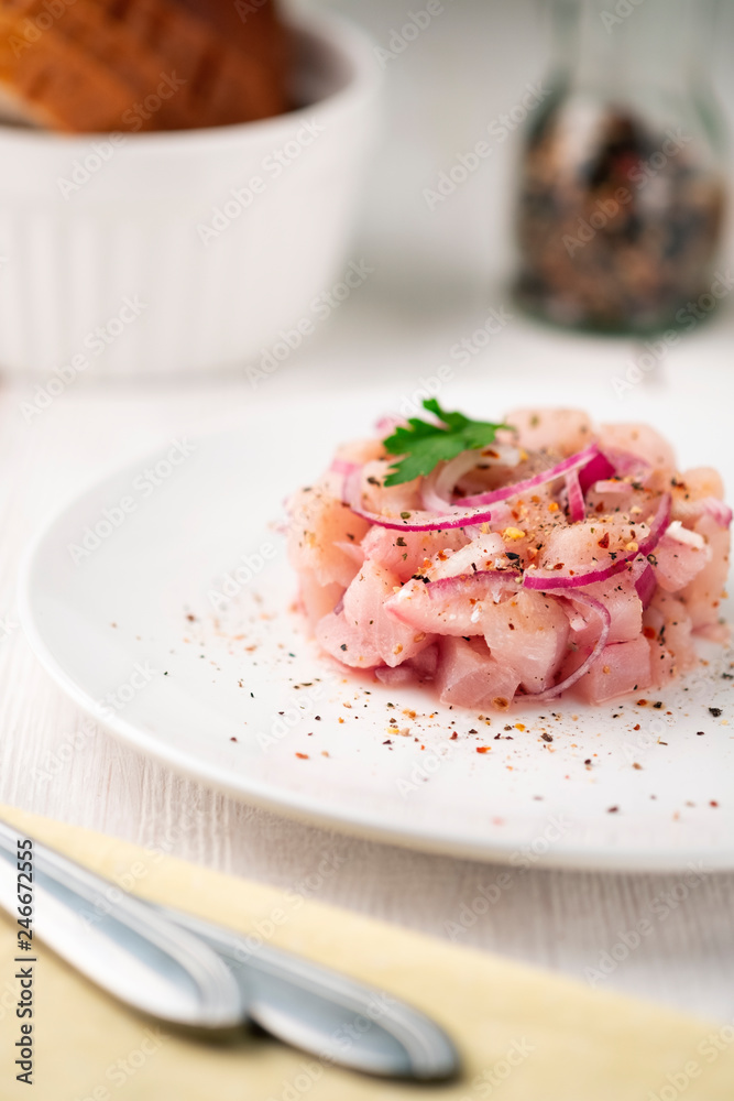 dish food of raw fish with whitefish on a light surface. national dish of the Northern peoples dish food of raw fish with whitefish on a light surface. national dish of the Northern peoples