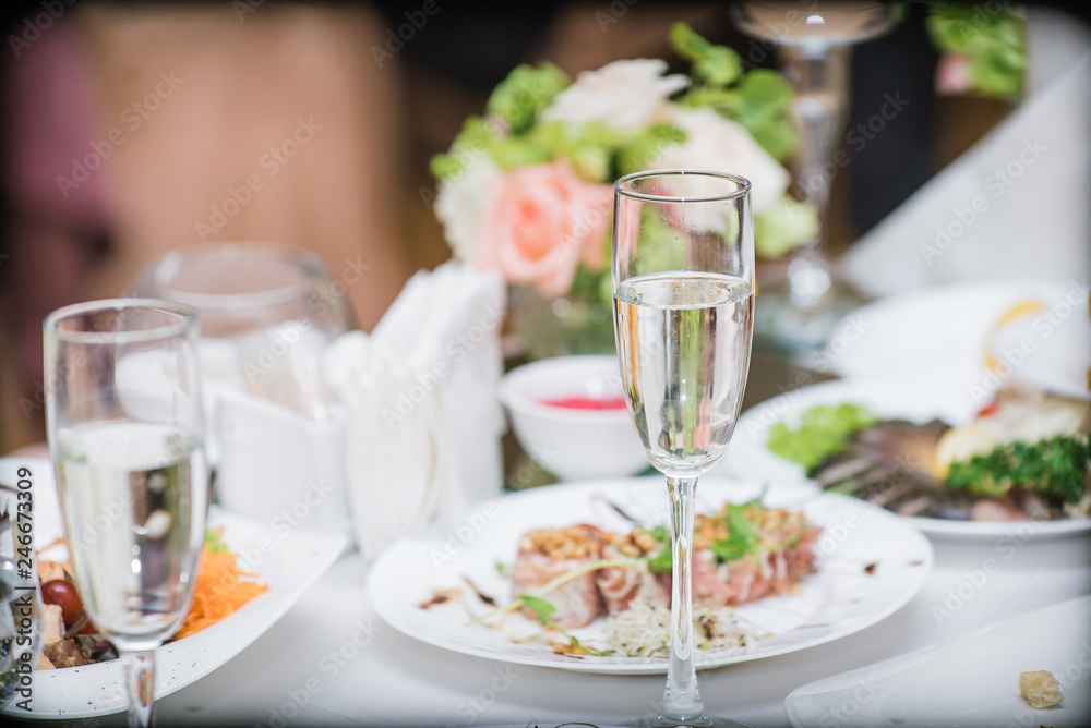 a glass of champagne on the holiday table a glass of champagne on the holiday table