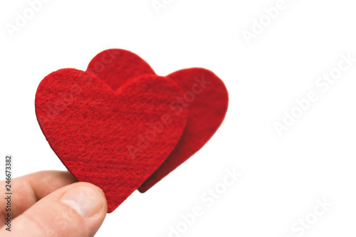 Red Heart in the fingers on a white background. Valentine's Day
