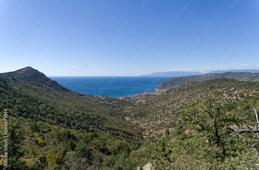 View to the sea from the slope of coastal mountains.