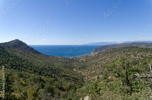 View to the sea from the slope of coastal mountains.