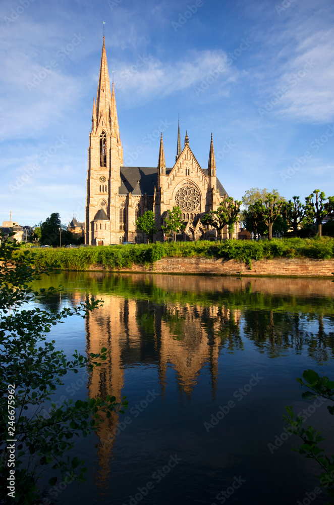 Portrait frame view of St. Paul's church from the front side of the river by reflections, France