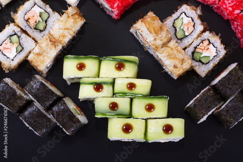 Japanese rolls with seafood on a dark background