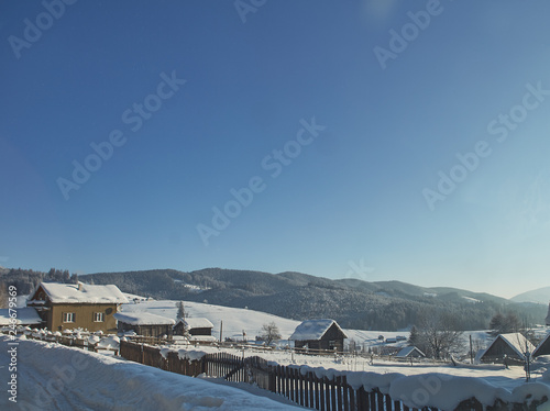 small village in the high mountains. sunny winter weather with clear sky