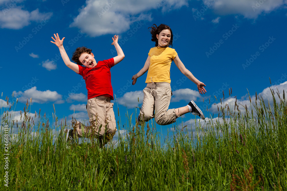 Girl and boy running, jumping outdoor Girl and boy running, jumping outdoor