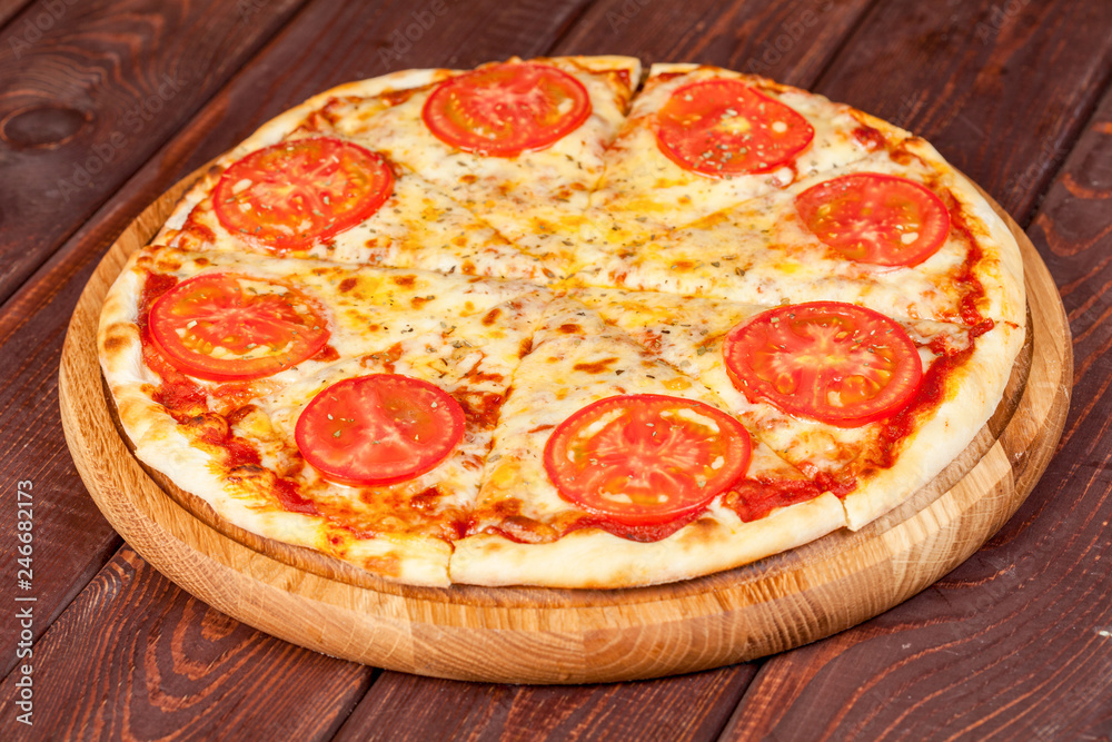 appetizing, fresh pizza on the table, for a design decoration in cooking appetizing, fresh pizza on the table, for a design decoration in cooking