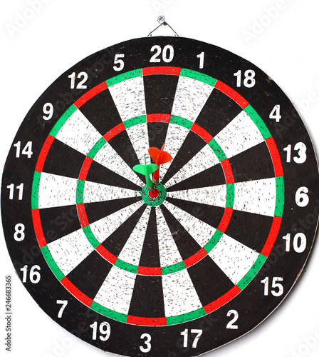 side view.Arrow dart hitting the center of the target dart Board