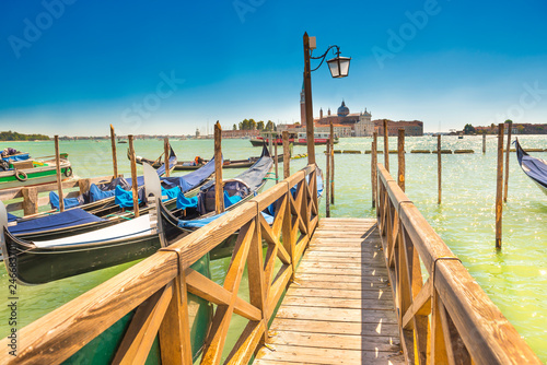 Pier with moored gondolas in Venice