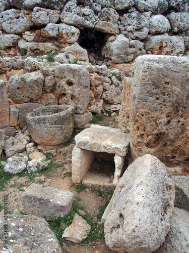 stone artifacts and walls in the talaiotic ruins of trepuco menorca photo