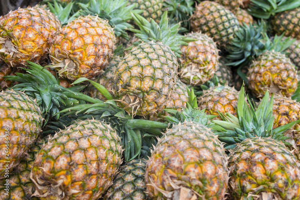 a lot of pineapples on market in Zanzibar a lot of pineapples on market in Zanzibar