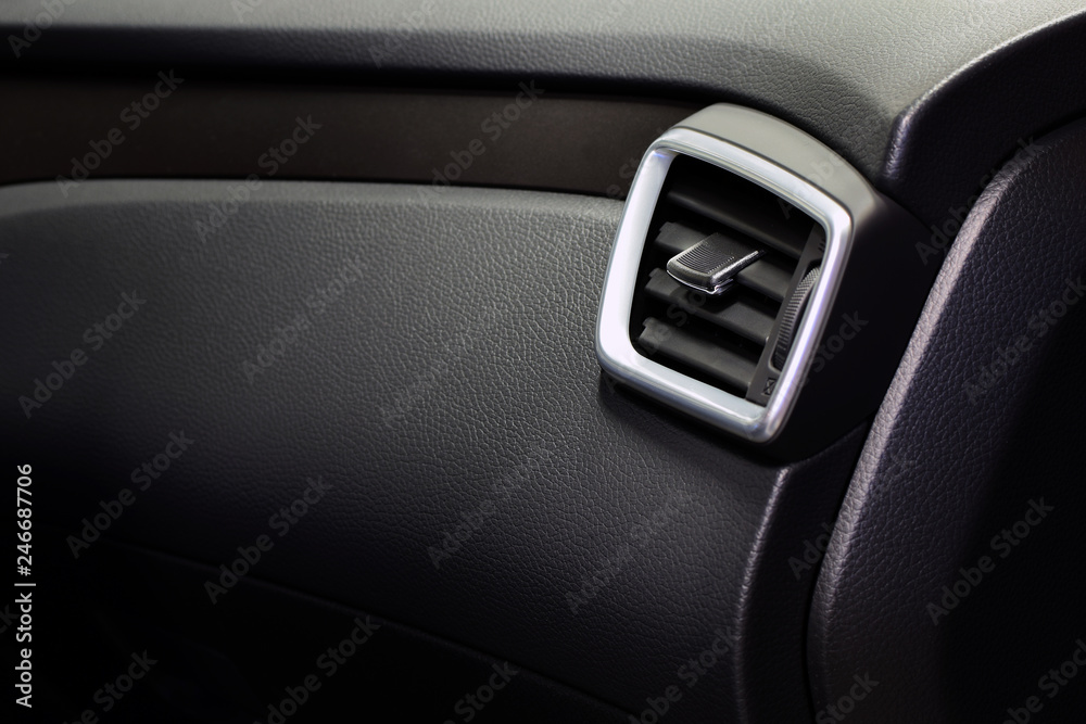 Modern car interior. Air ventilation, car glove box and dashboard. Copy space