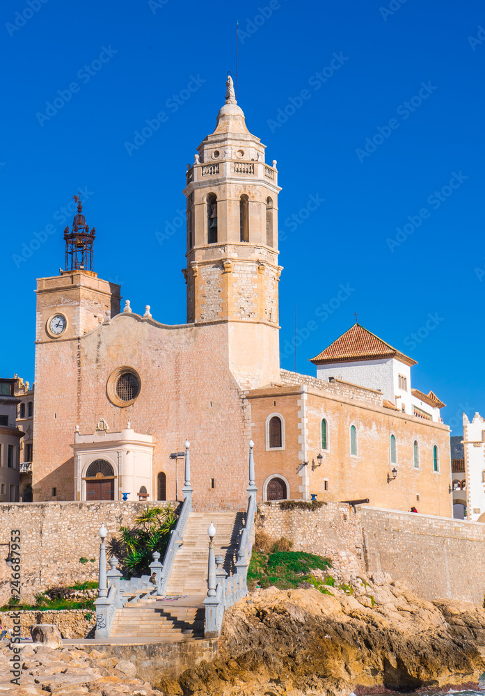 Sitges church with a blue sky Sant Bartomeu & Santa Tecla in Barcelona, Spain
