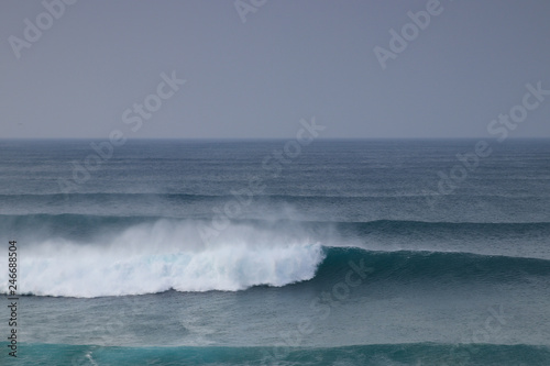 Waves crashing in the ocean in Algarve  Portugal an early morning just after summer. Perfect for surfing.