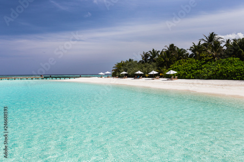 Fototapeta Naklejka Na Ścianę i Meble -  Beach chairs with a view of clear blue water in the Maldives