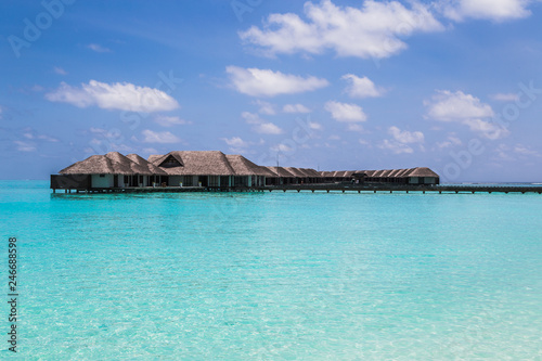 Fototapeta Naklejka Na Ścianę i Meble -  Water villas on the clear blue beach in the Maldives