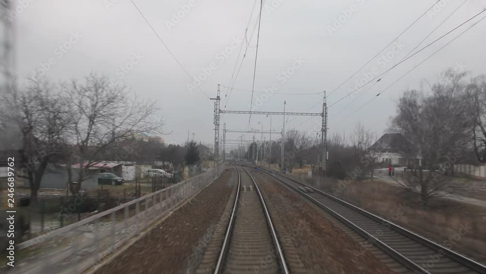 View from the last coach of high-speed suburban train. Railroad view from the last wagon of a passenger train. 4K View from the last coach of high-speed suburban train. Railroad view from the last wagon of a passenger train. 4K